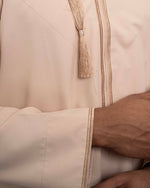 Peach Cream Omani Thobe – close up 100% wrinkle-free spun polyester soft peach fabric | Furqanwear Canada
