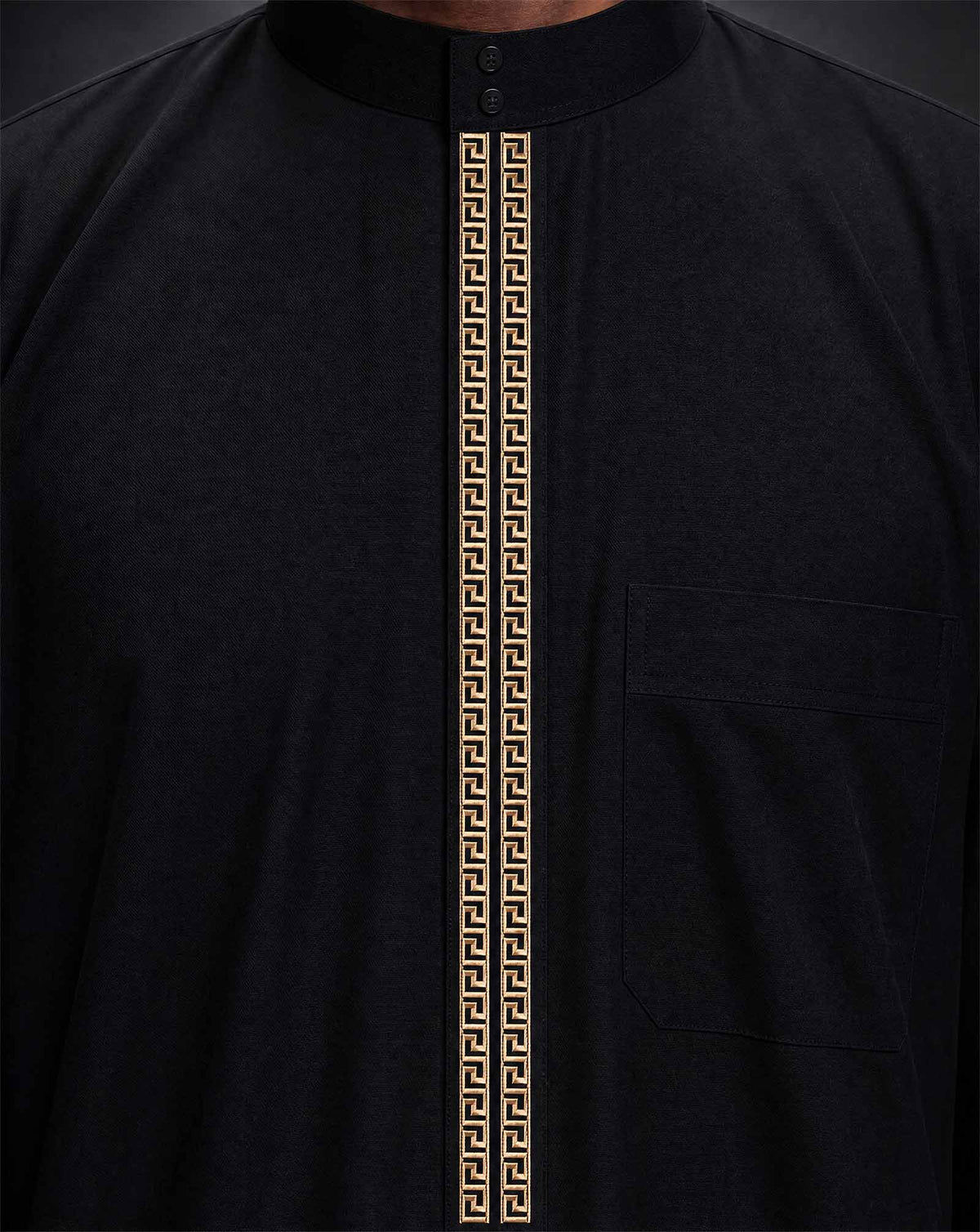 Close-up of gold embroidery on black Saudi thobe collar and placket — Furqanwear