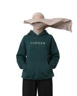 Woman in hijab showing the From Him To Him back print on a forest green Furqanwear Islamic hoodie