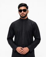 Close-up of bronze geometric embroidery on black designer Saudi thobe collar — Furqanwear