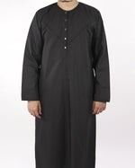 Close-up detail of the button placket and collar on a black classic mens thobe jubba, a form of muslim dress for men.