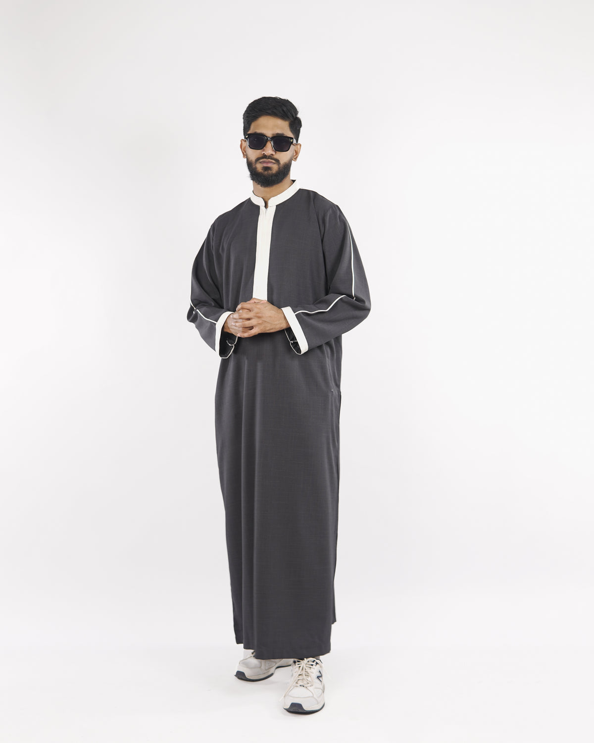 Front view of the Royal Thobe in charcoal, showcasing the white trim detail; a premium mens thobe jubba and muslim dress for men.