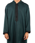 Close-up of the torso area of a men's hooded green thobe, showing the black embroidered trim on the placket and cuffs.