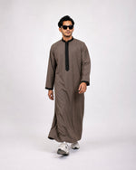 Muslim man wearing olive Royal Thobe – full-length front view