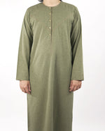 Detailed close-up of the button placket and collar on a sea green classic thobe, illustrating the quality of this muslim dress for men.