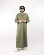Model wears a sea green classic thobe, shown full length from the front, a fine example of islamic attire for men.